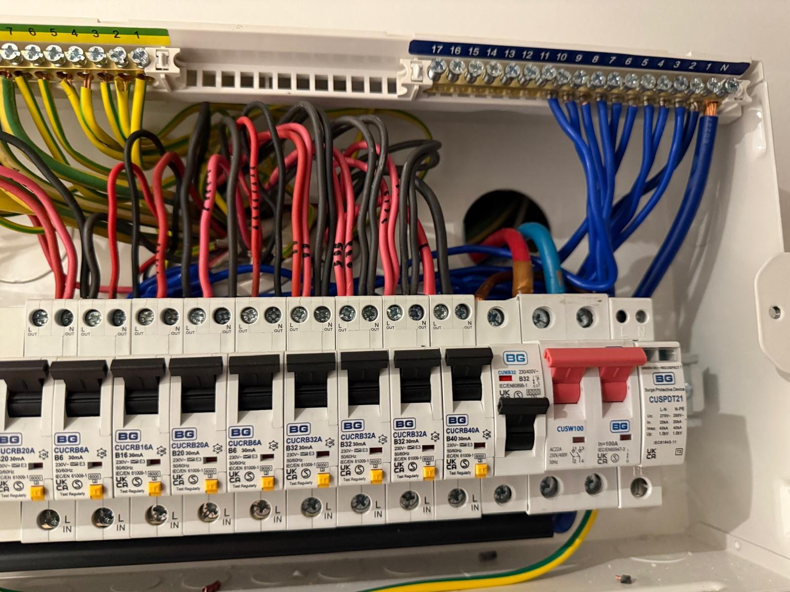 W Day Electrics engineer meeting a customer beside the company van